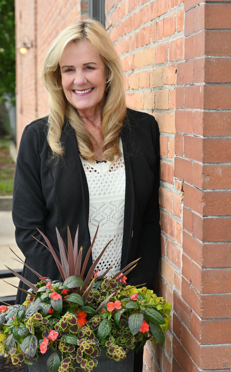 Woman Smiling with Flowers