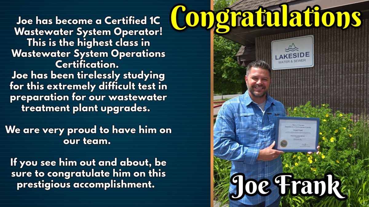 Proud man standing with award