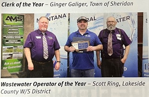 Proud man standing with award